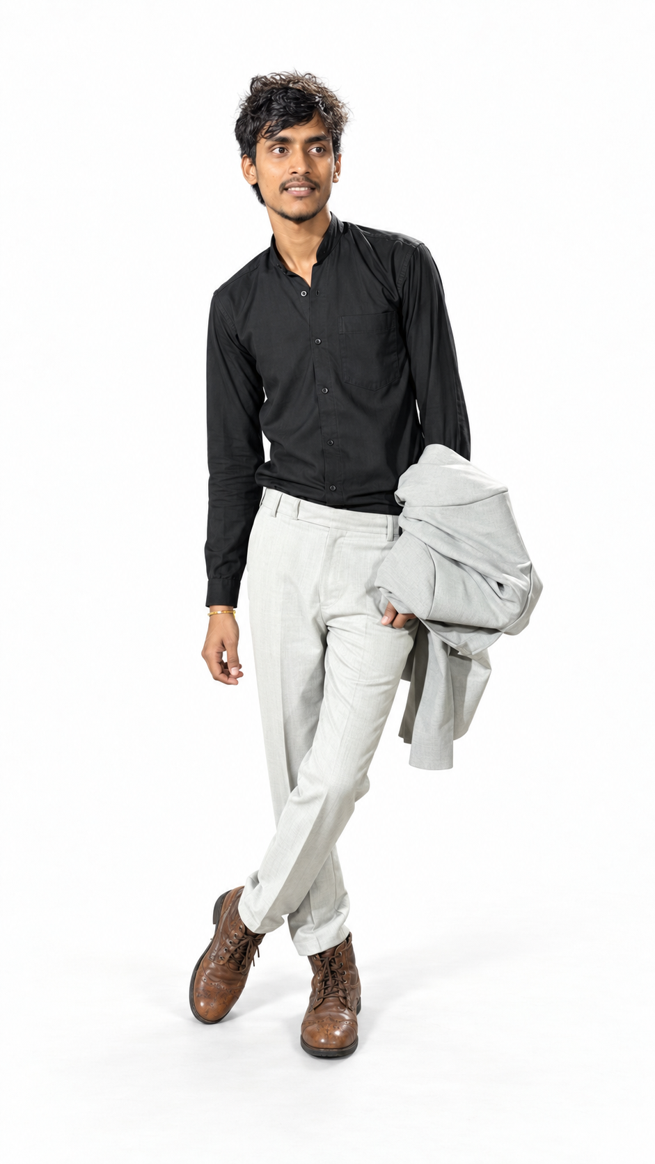 Chanchal K Maurya standing in a black shirt and light trousers